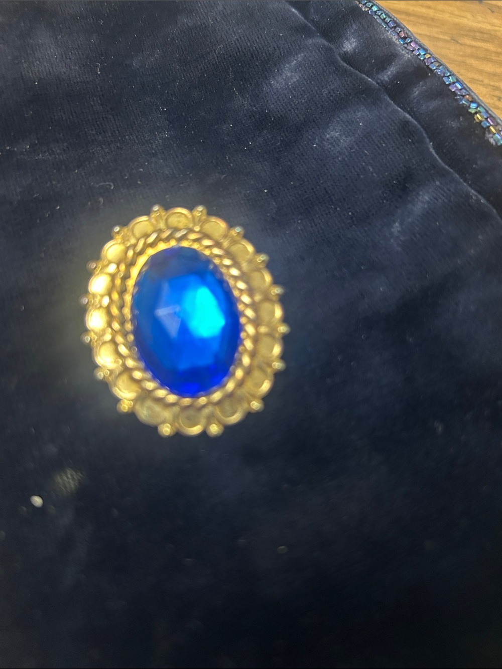 Gold-tone Brooch with Deep Blue Cabochon